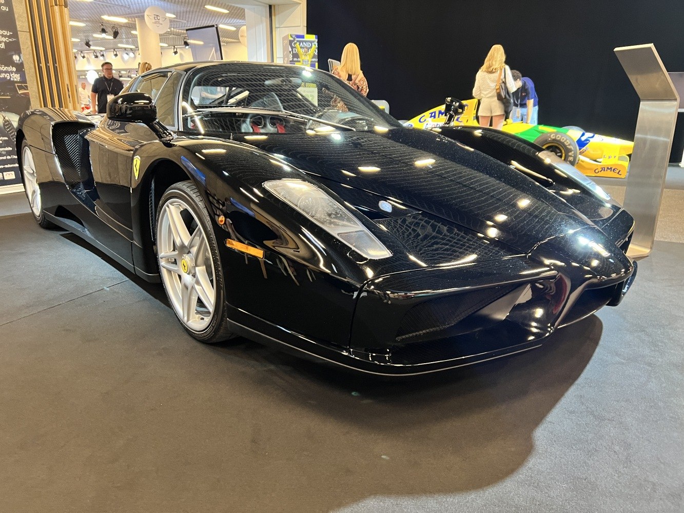 Aerodynamic front end and sleek body lines of a black high-performance supercar