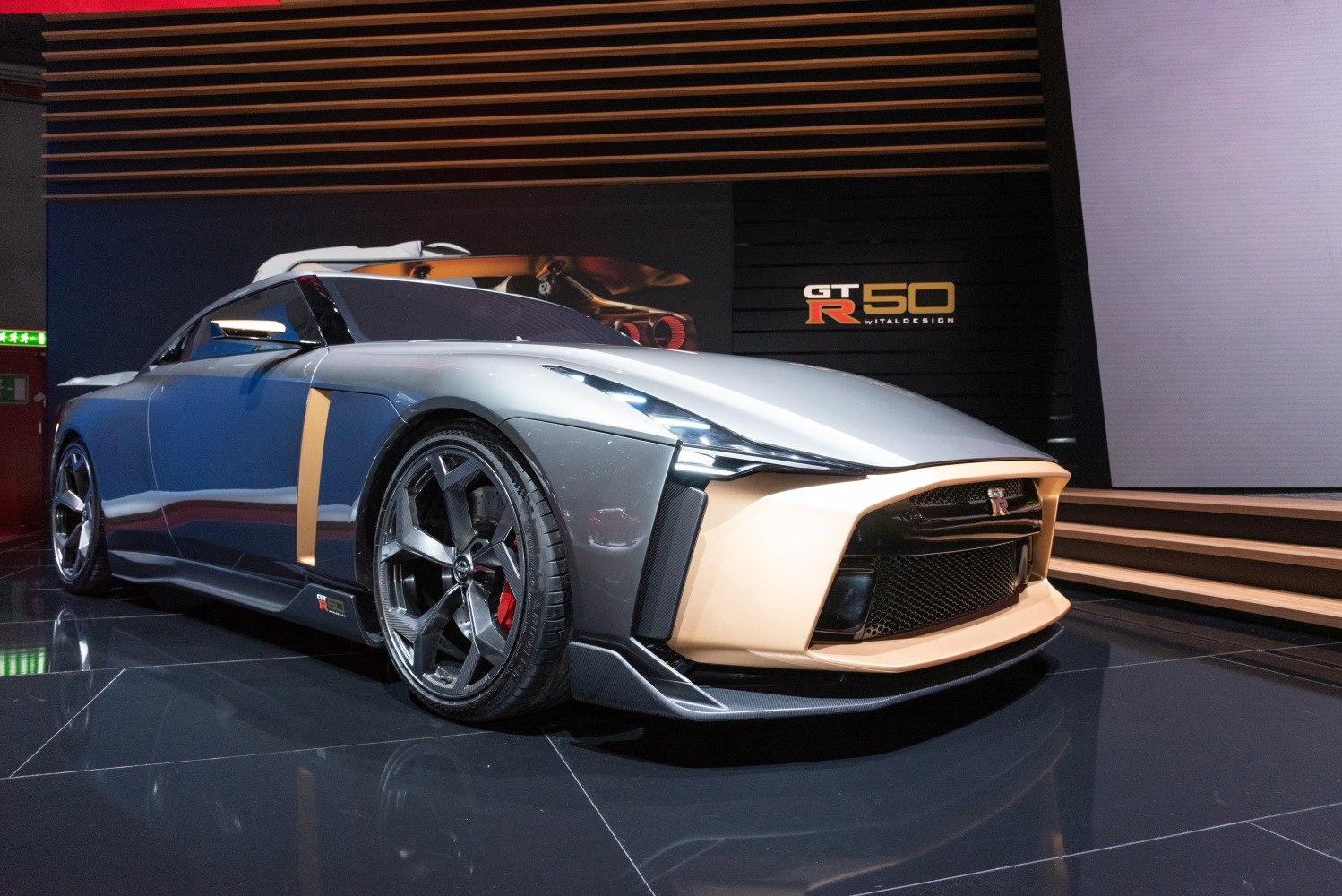 Front view with aggressive grille and large alloy wheel with red brake caliper