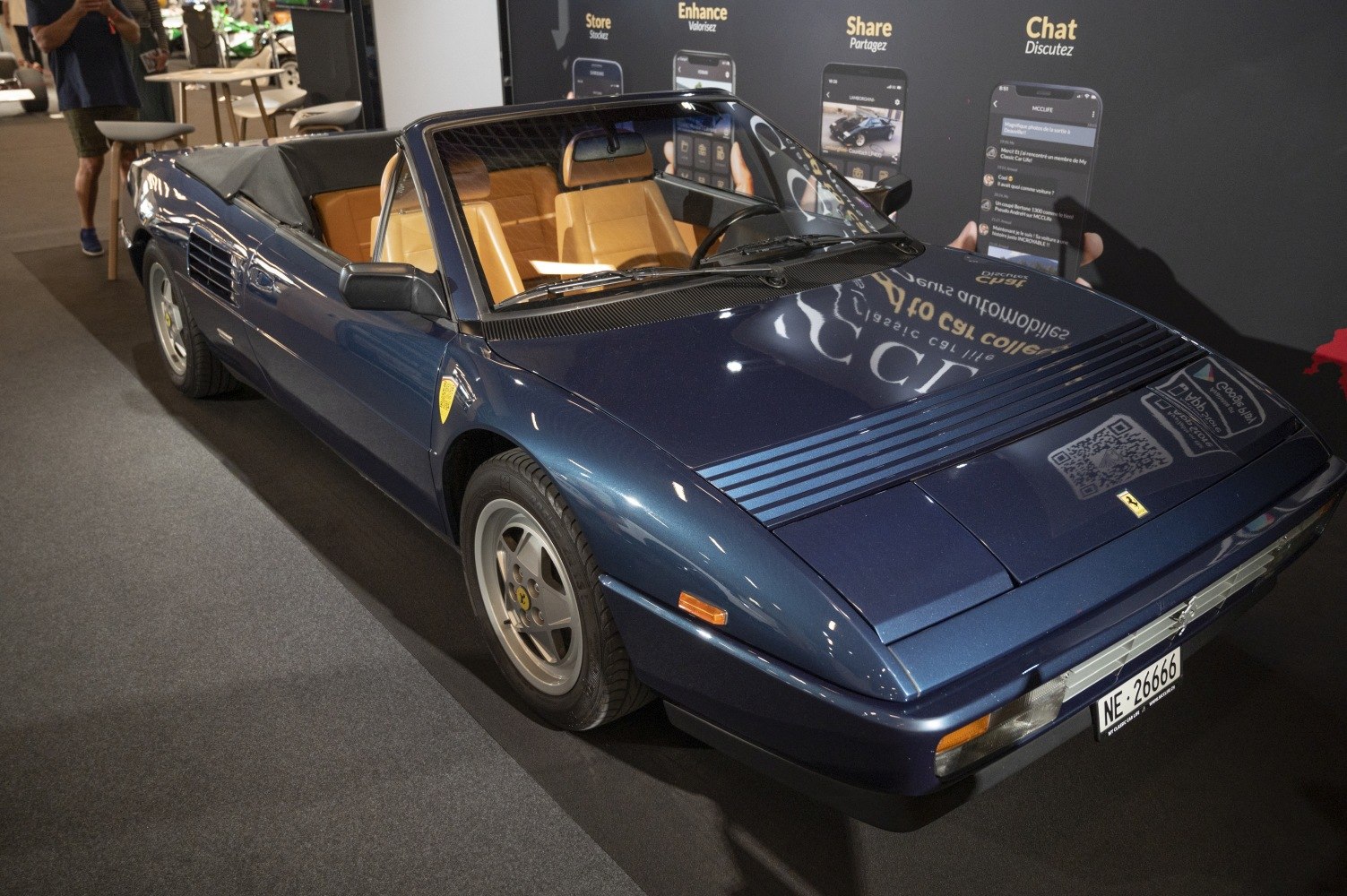 Convertible sports coupe with tan leather seats and vented hood design