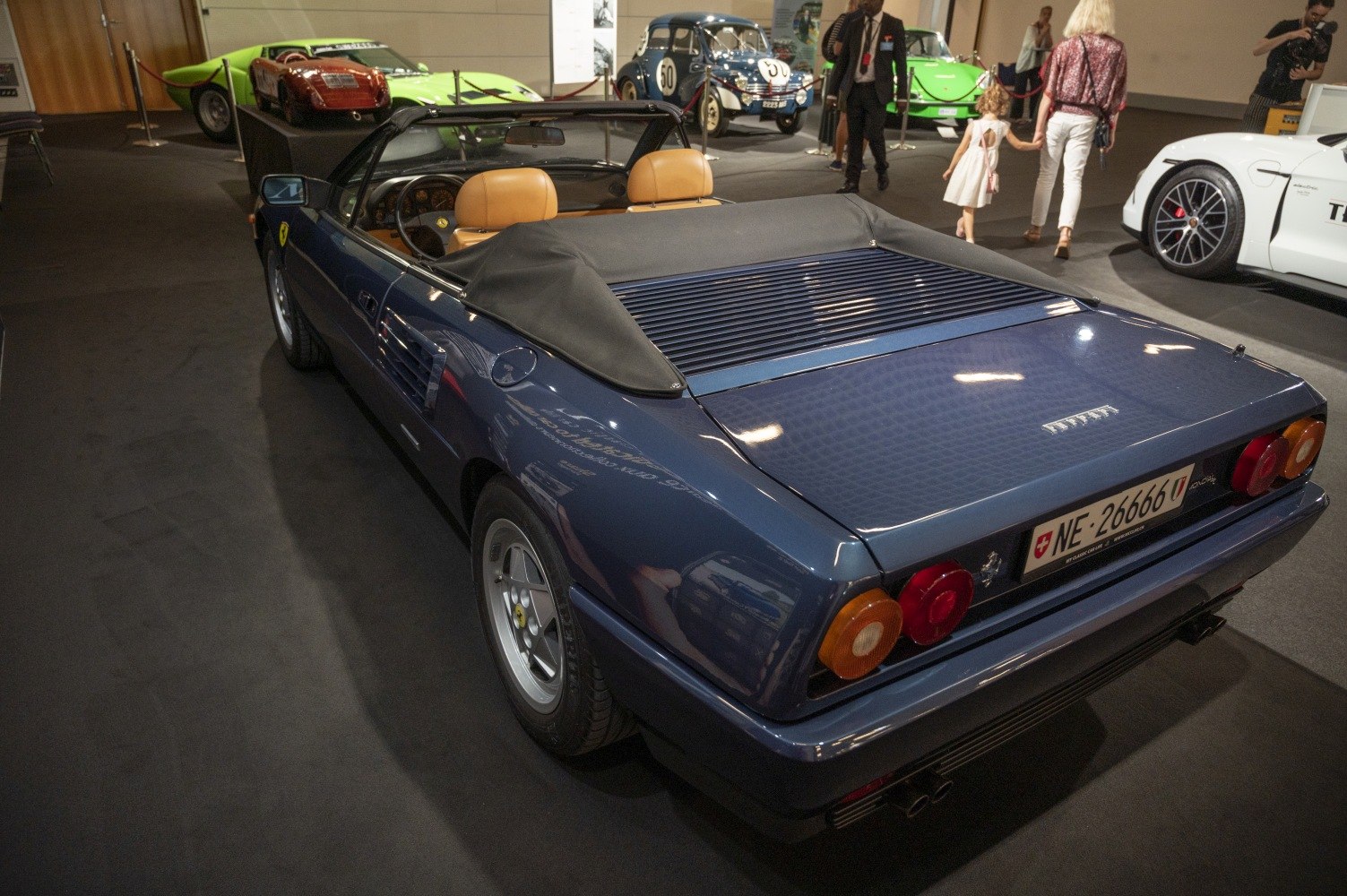 Rear view of convertible with vented engine cover and dual round tail lights