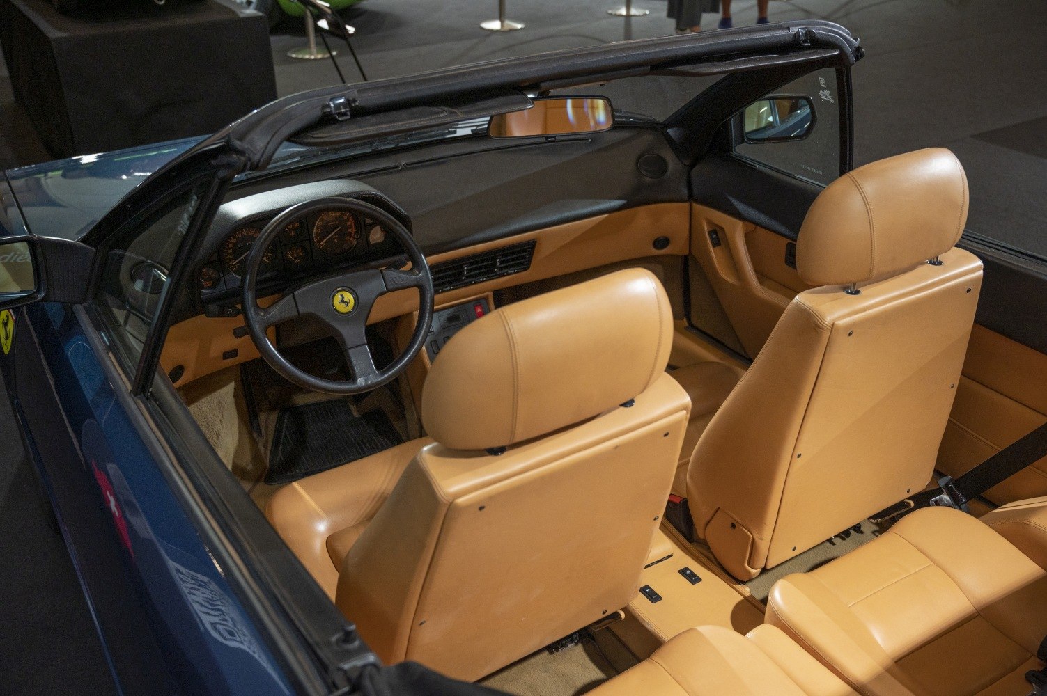 Vintage tan leather interior with dashboard and steering wheel.