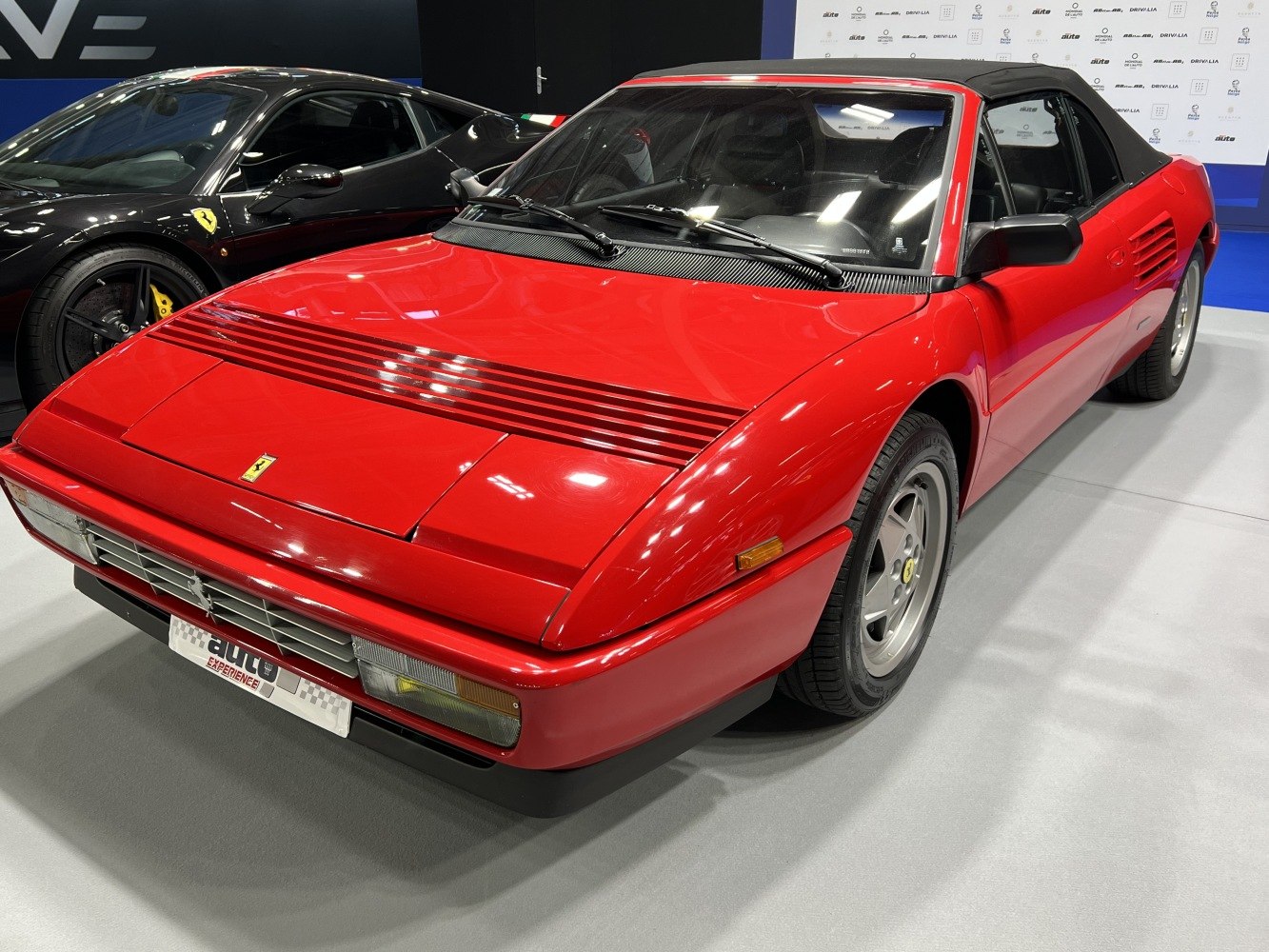 Red convertible with pop-up headlights and side air vents