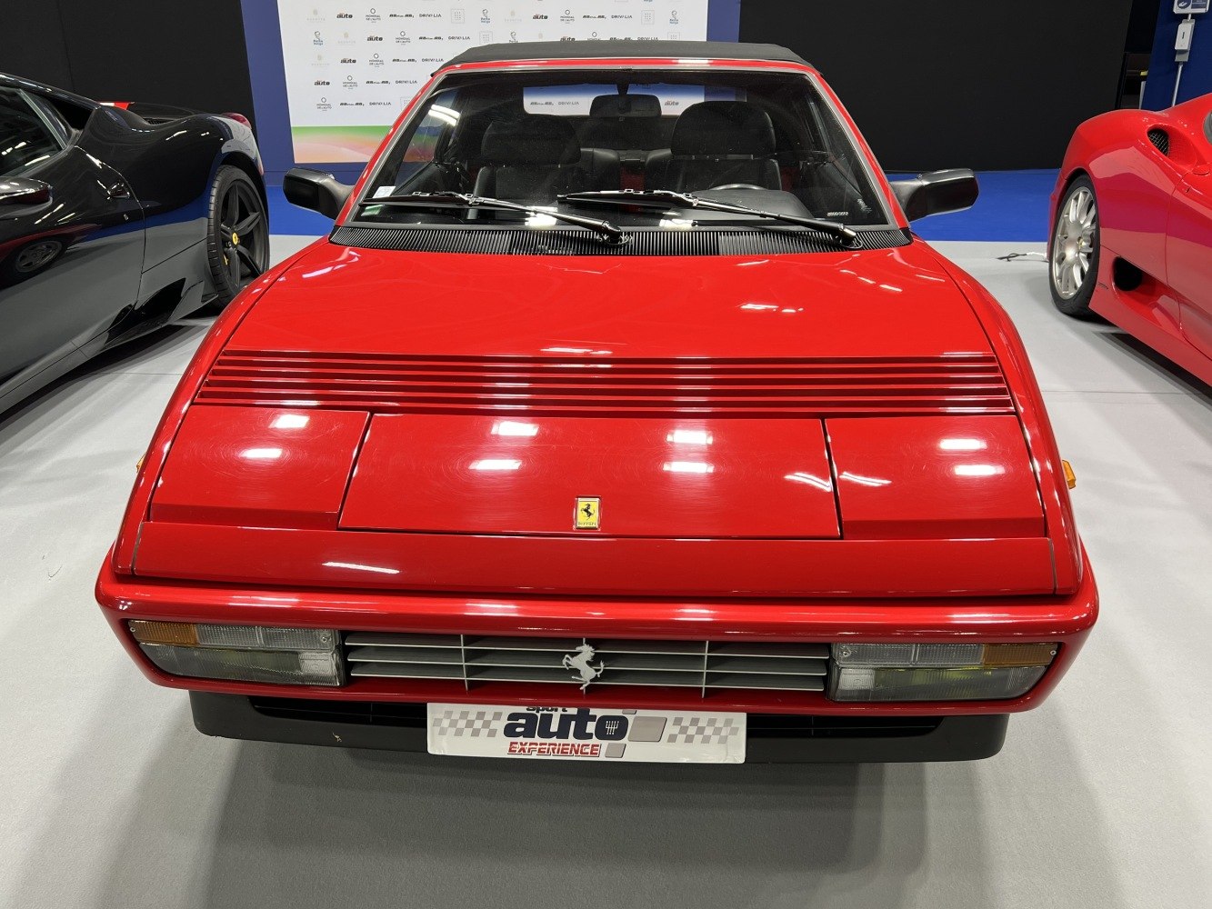 Classic pop-up headlights and horizontal grille on sporty coupe front