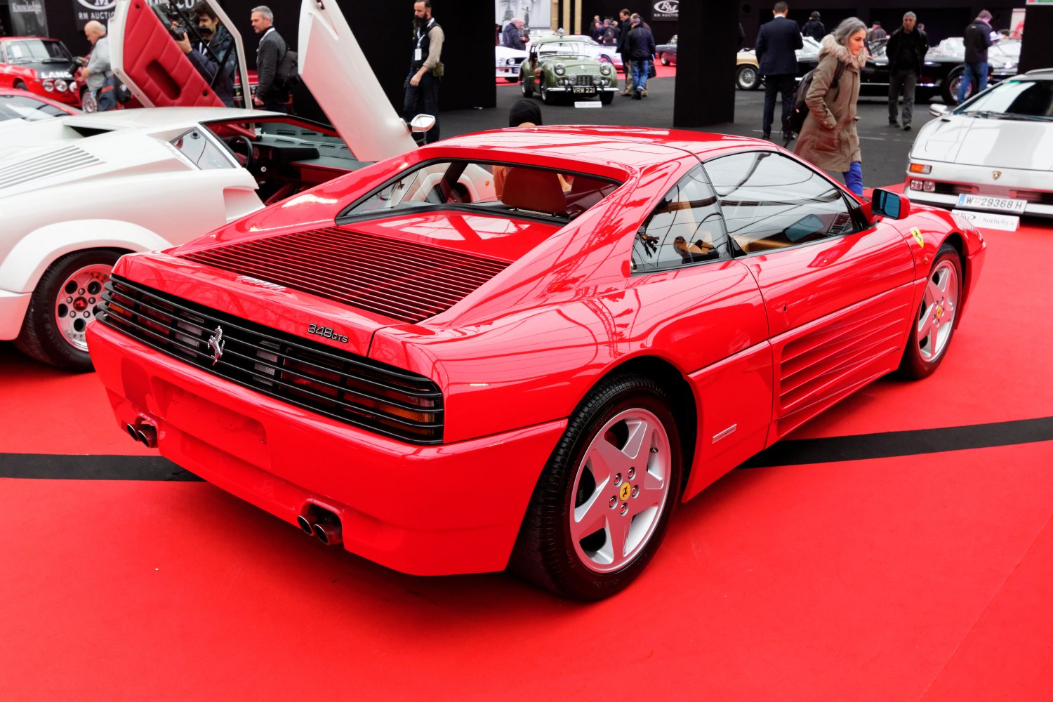Red Ferrari 348 GTS rear and side with louvered engine cover and five-spoke wheels