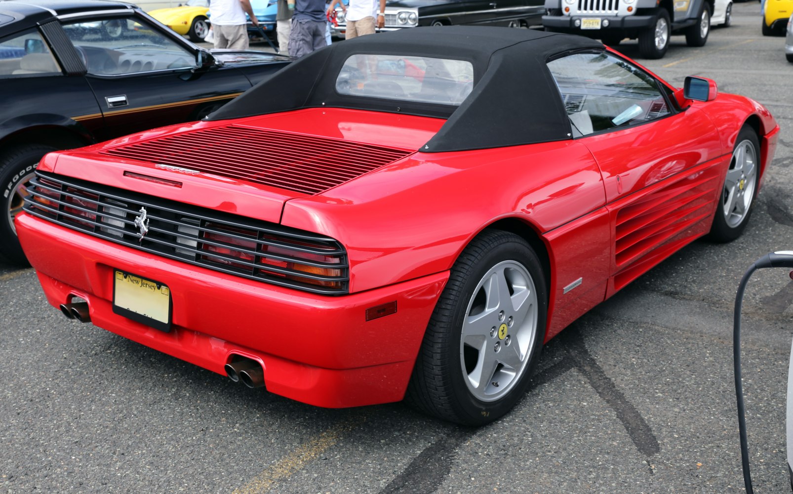 Soft top convertible rear and side view with rear vents and alloy wheels