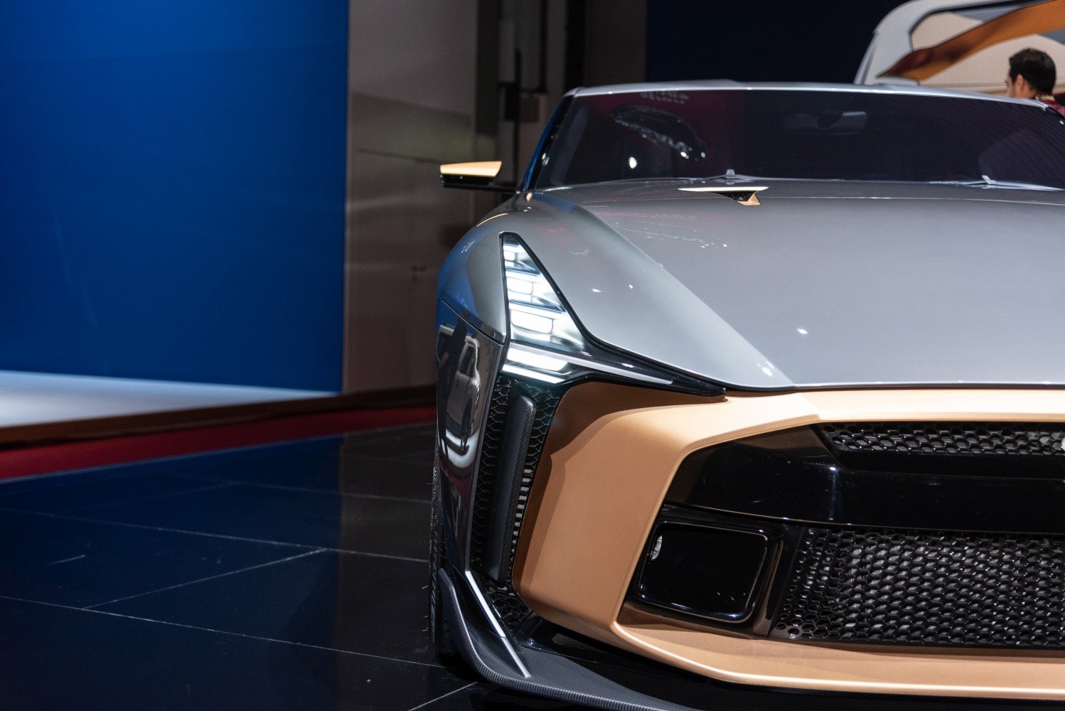 Close-up of front LED headlights and grille of a high-performance sports vehicle