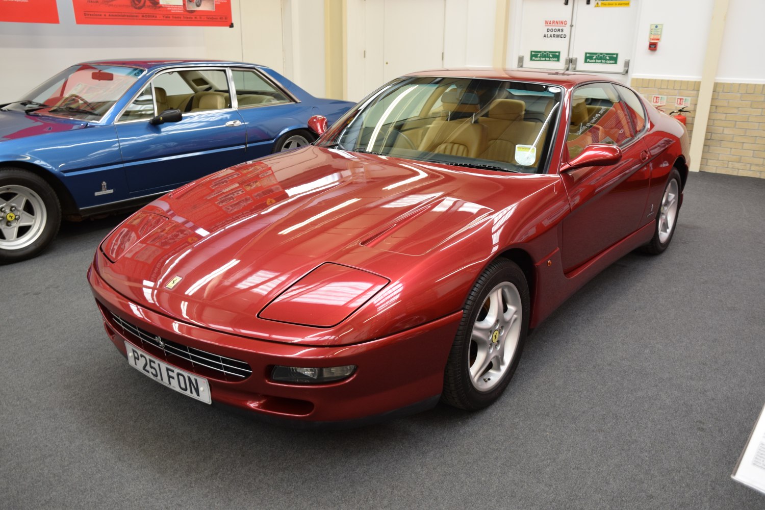 Sleek red coupe with pop-up headlights and alloy wheels