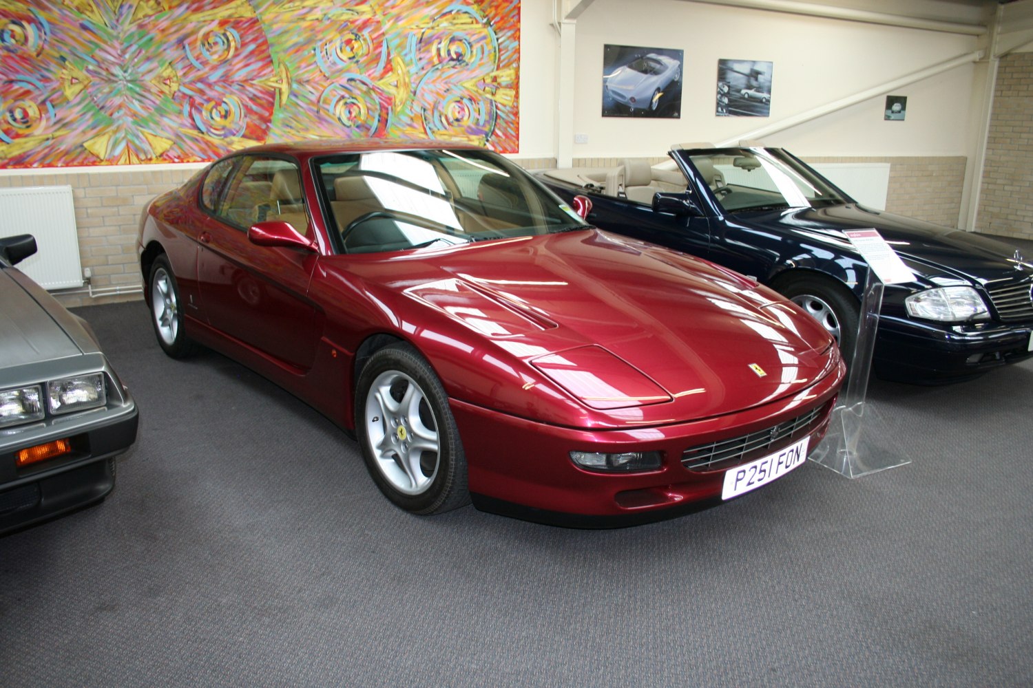 Sleek red coupe with aerodynamic body and pop-up headlights