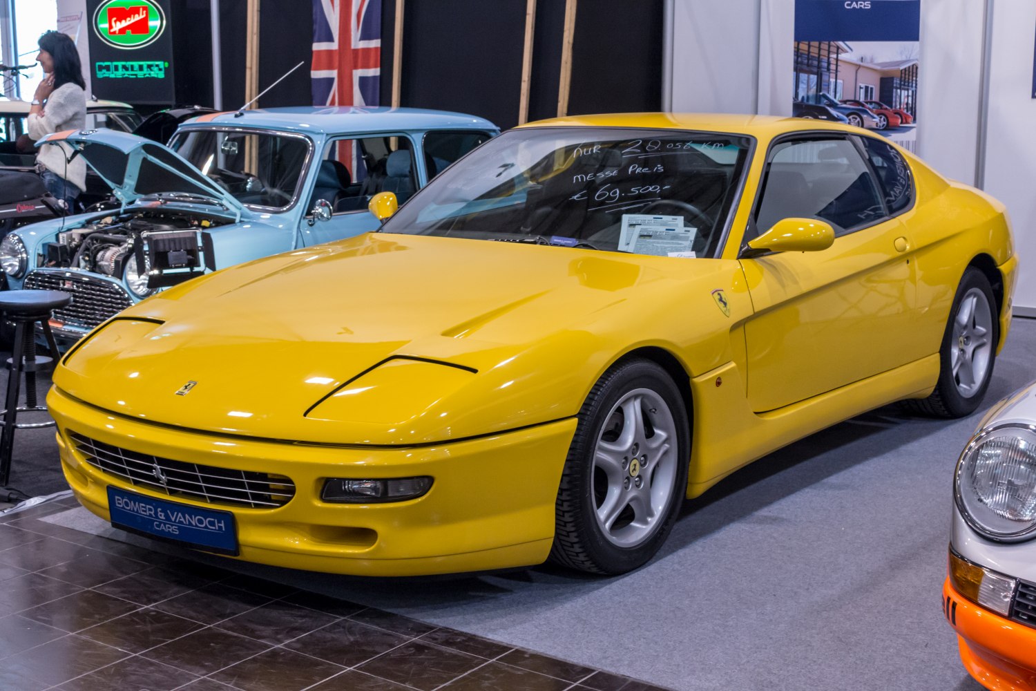 Yellow vintage sports coupe with pop-up headlights and sleek aerodynamic design