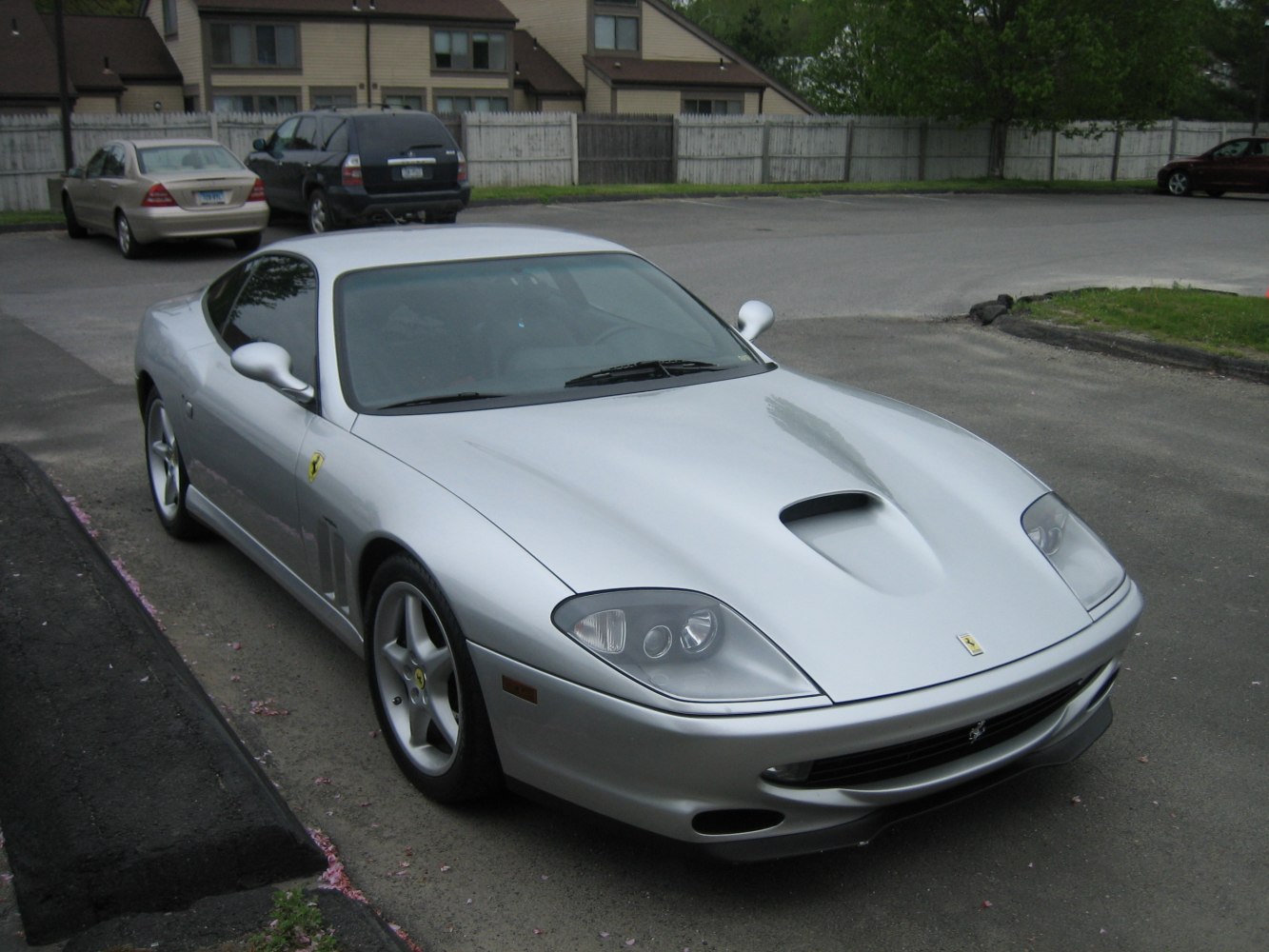 Front angled view with hood scoop and sleek aerodynamic shape