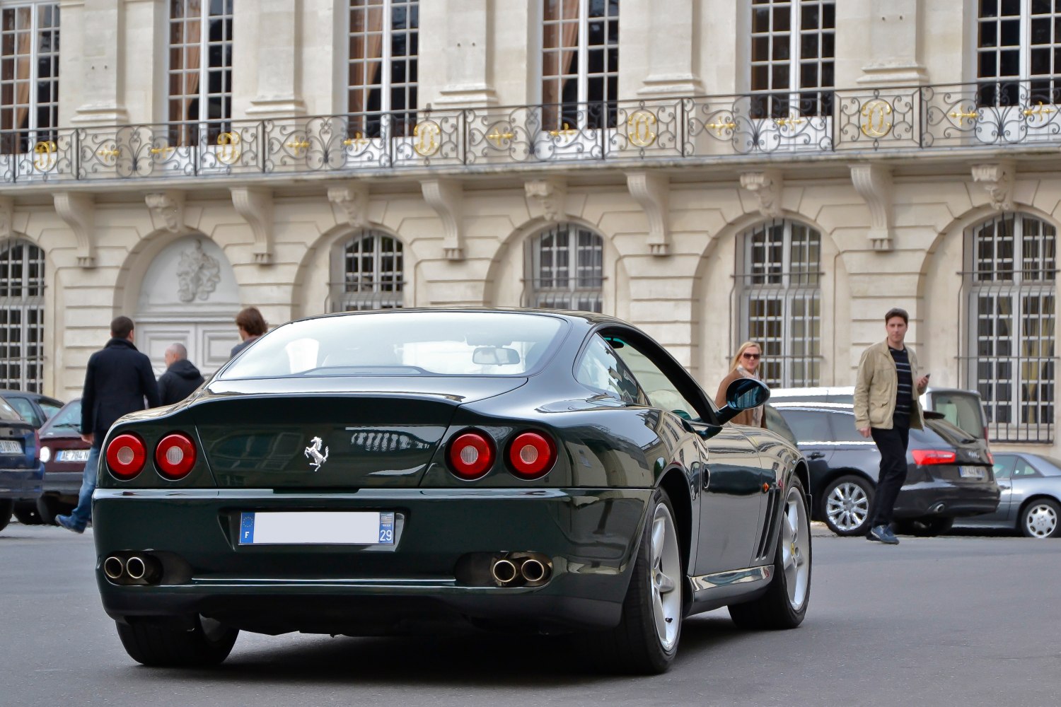 Rear view with round taillights and quad exhaust pipes