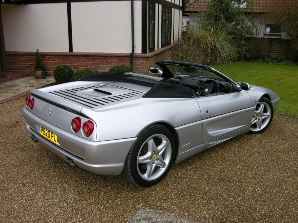 Convertible showing rear with taillights and side profile with alloy wheels