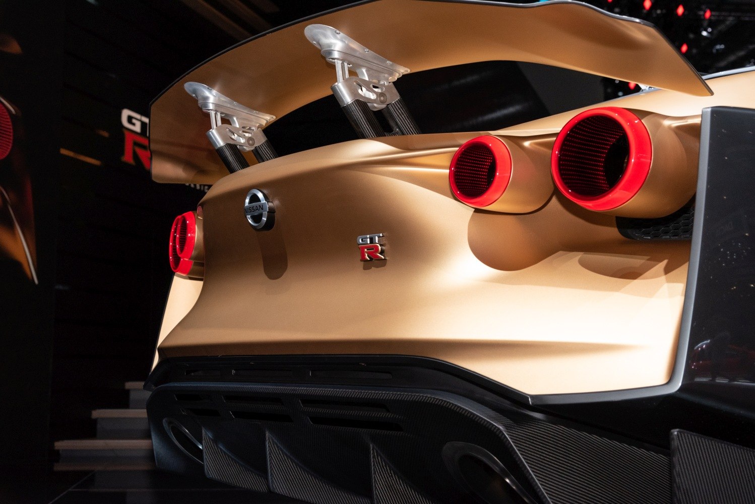 Rear design with large spoiler and quad round tail lights