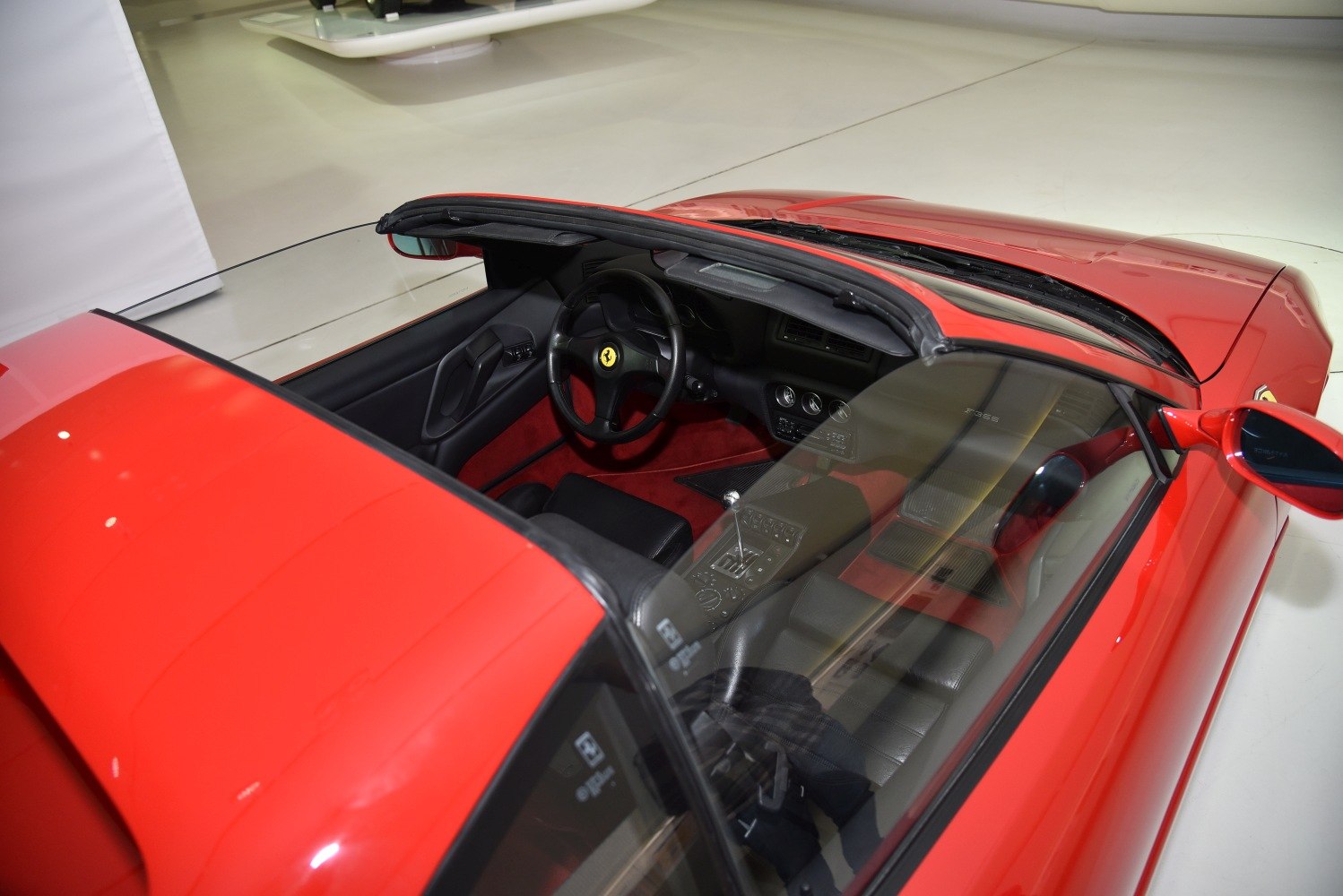 Convertible roof and detailed sports car interior with manual transmission