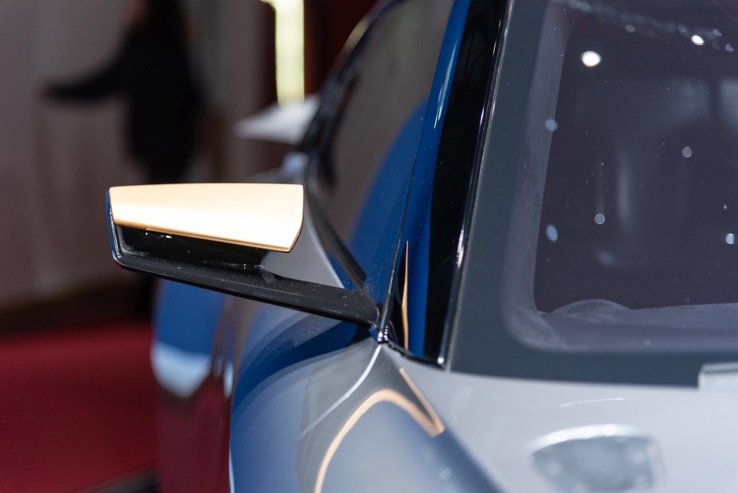 Side mirror and window detail on a sleek sporty vehicle