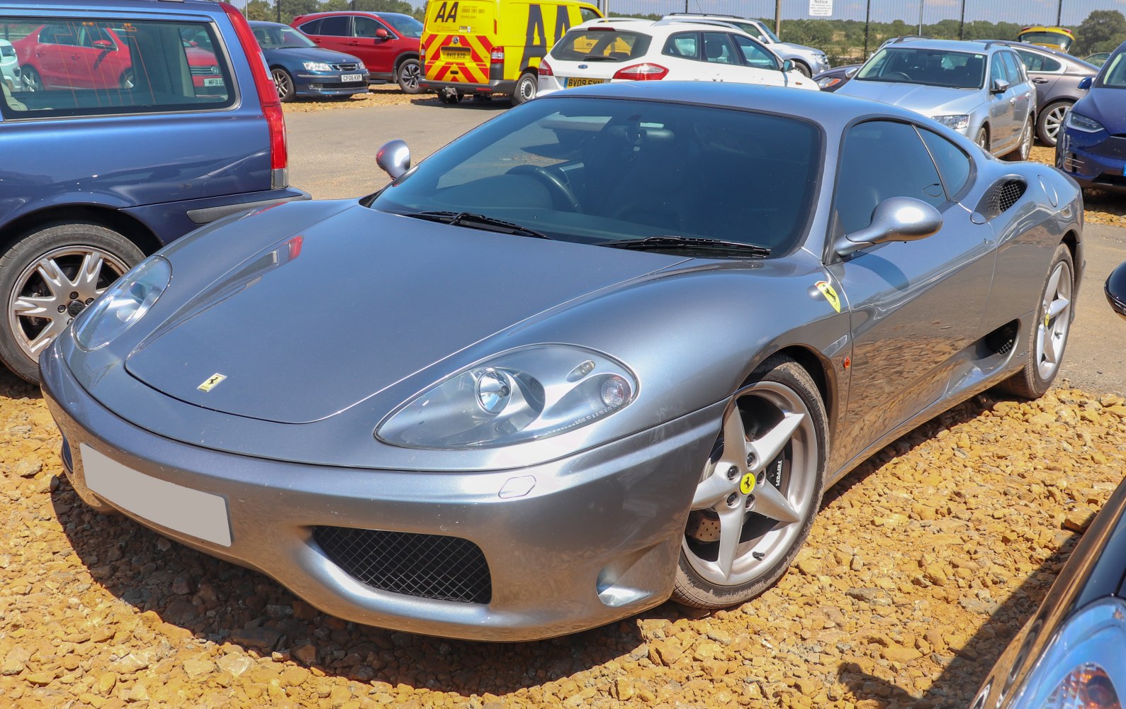Silver sports coupe with aerodynamic body and alloy wheels