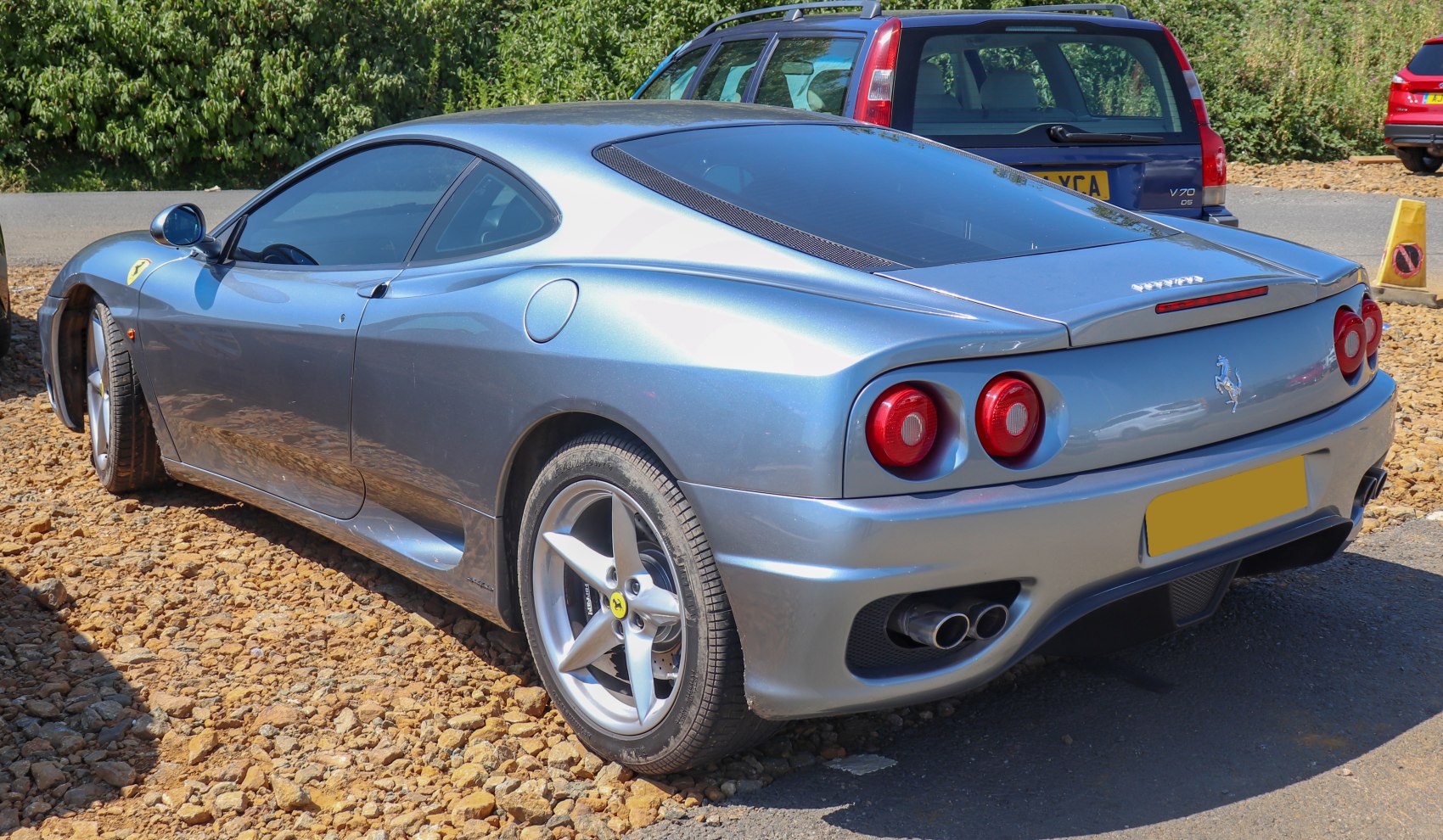Rear-side view with dual round taillights and five-spoke wheels