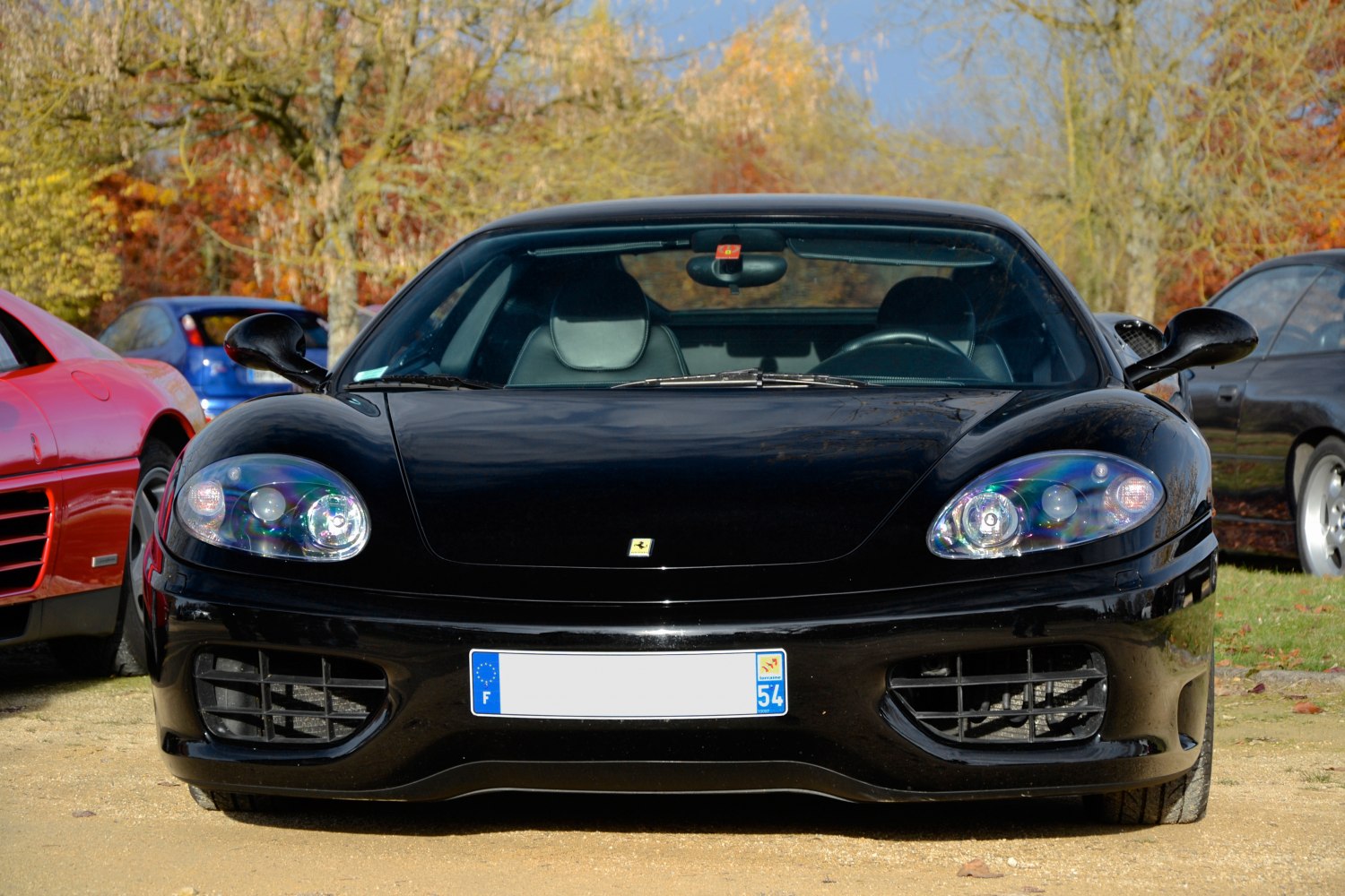 Front view of high-performance sports car with distinctive headlights and wide grille