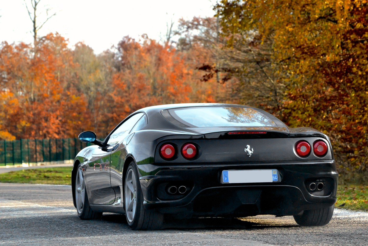 Rear view with quad round taillights and dual exhaust outlets