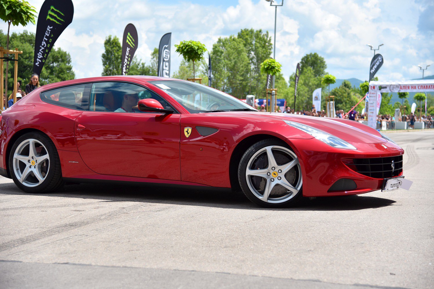 Sleek red Ferrari FF with distinctive alloy wheels