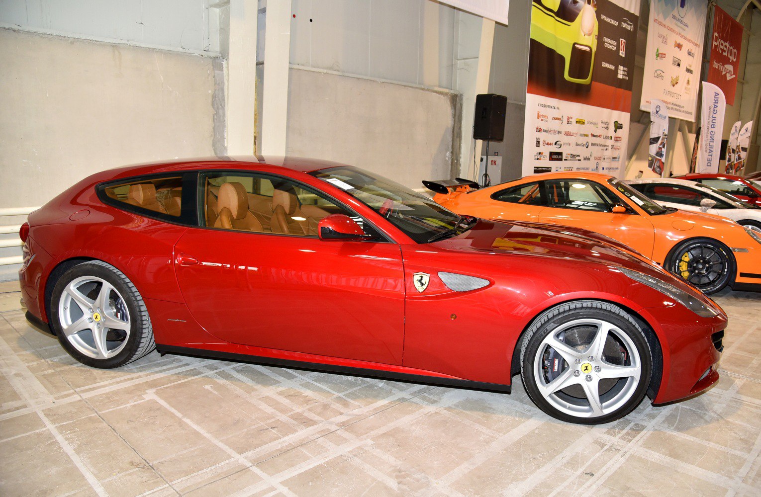 Red shooting brake with tan leather interior and five-spoke alloy wheels
