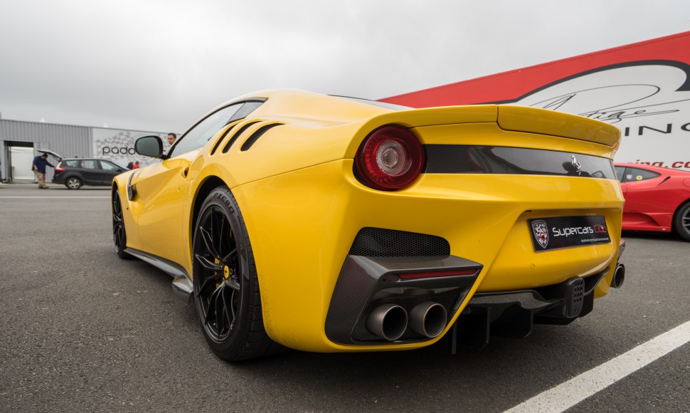 Yellow rear view with quad exhausts, air vents, and black wheels