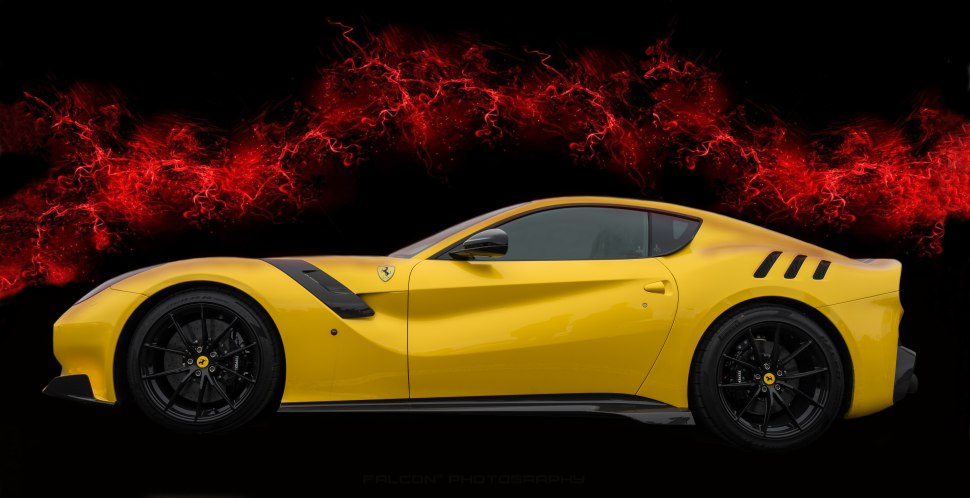 Yellow sports coupe with aerodynamic features and black rims.