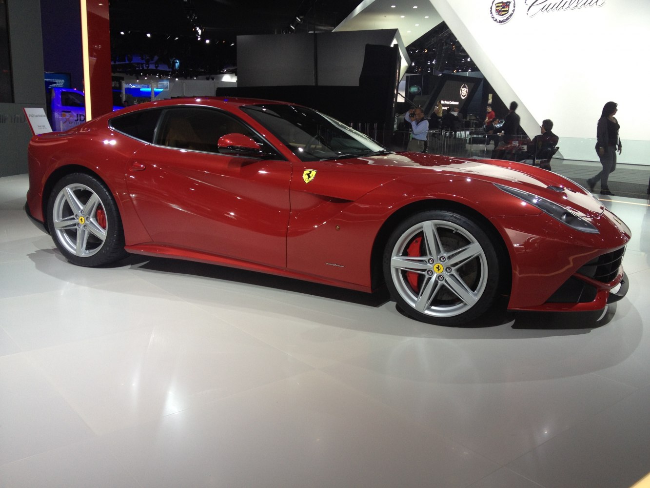 Aerodynamic red sports coupe with five-spoke alloy wheels and dynamic side profile