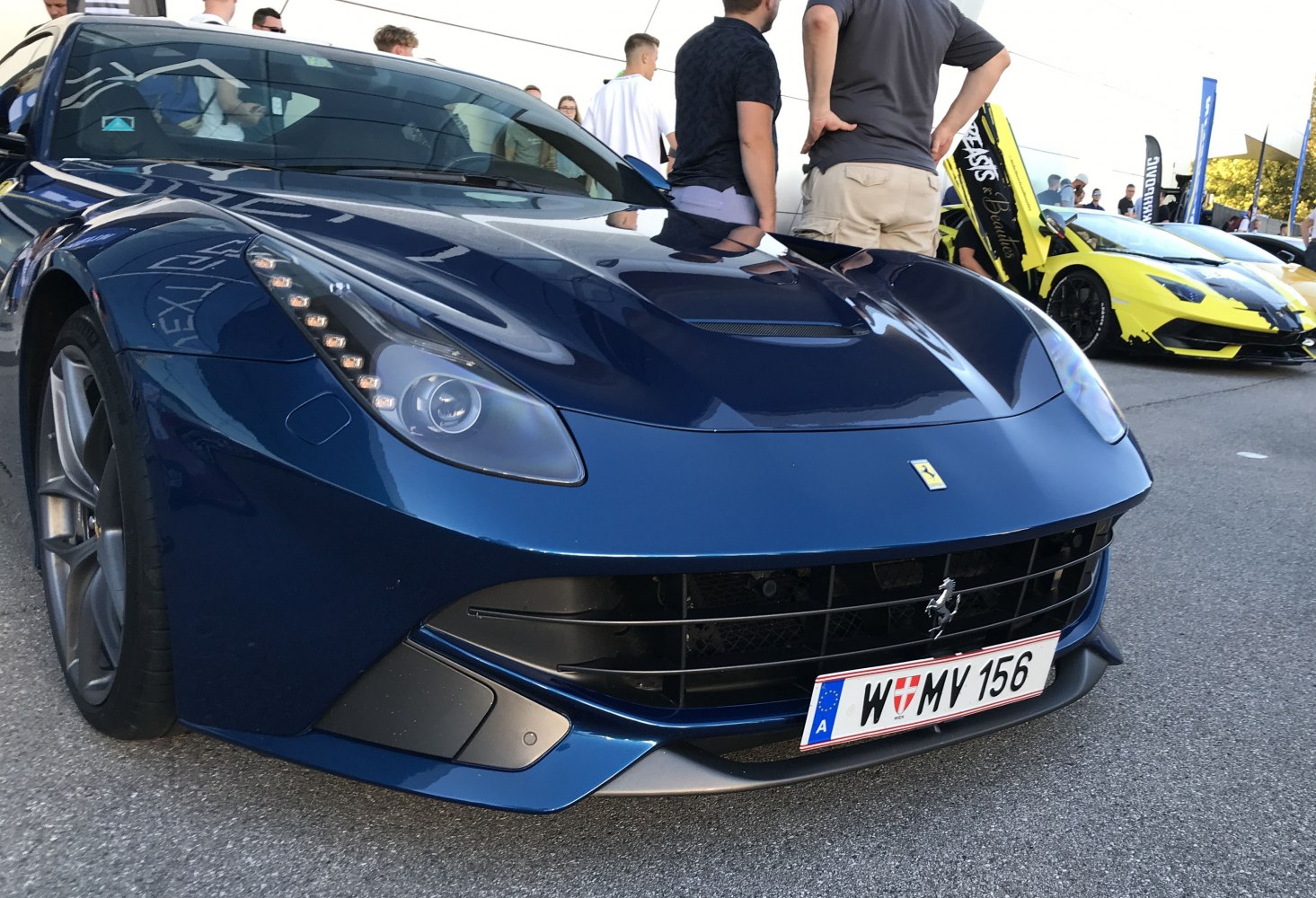 Close-up on aerodynamic front with LED headlights and grille