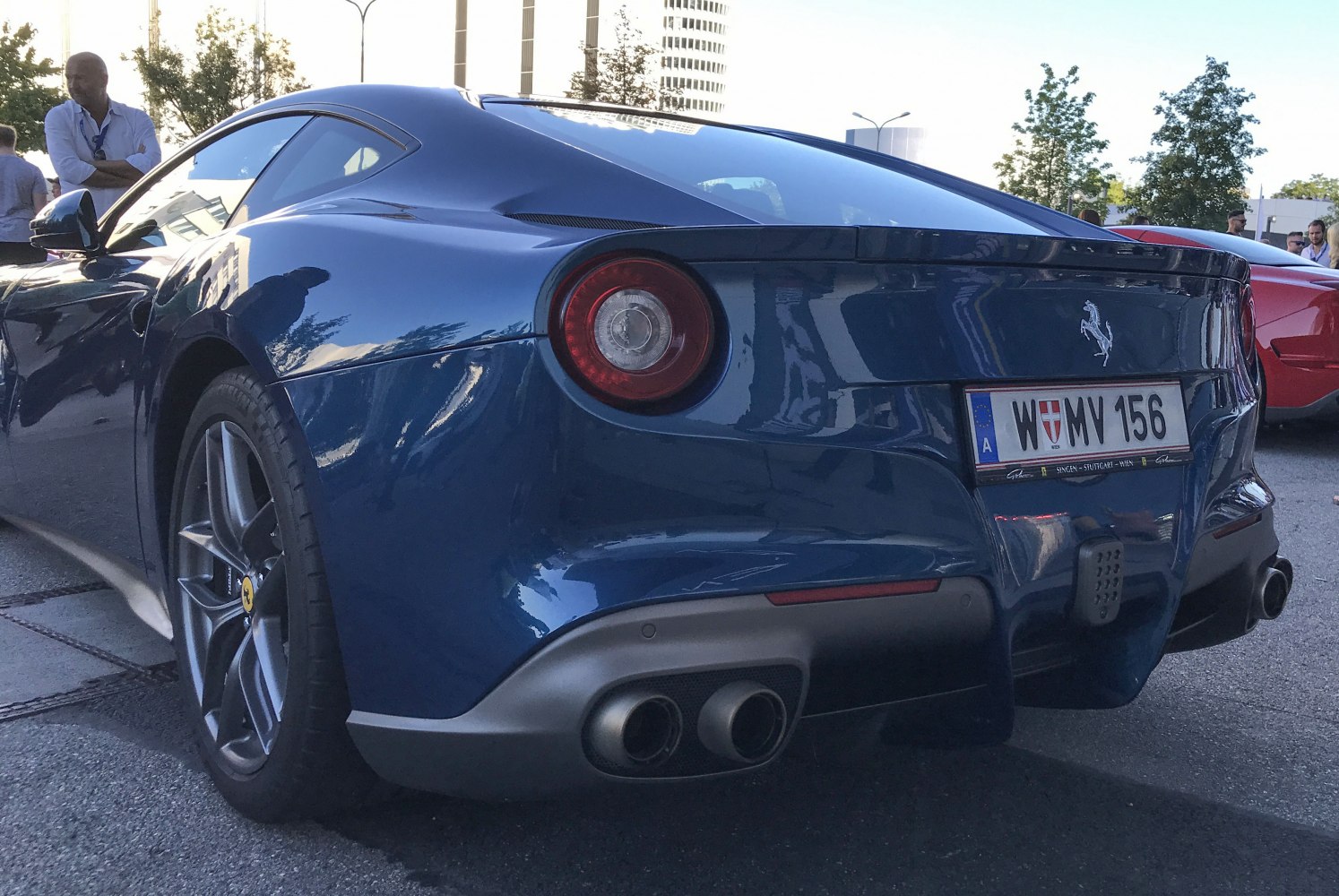Rear perspective showing circular taillights and dual exhaust pipes.