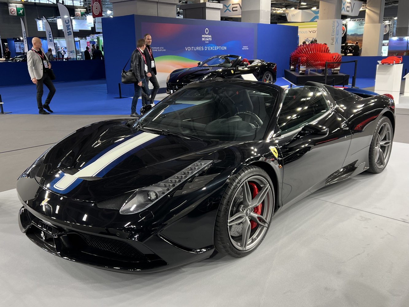 Black convertible with racing stripe and red brake calipers
