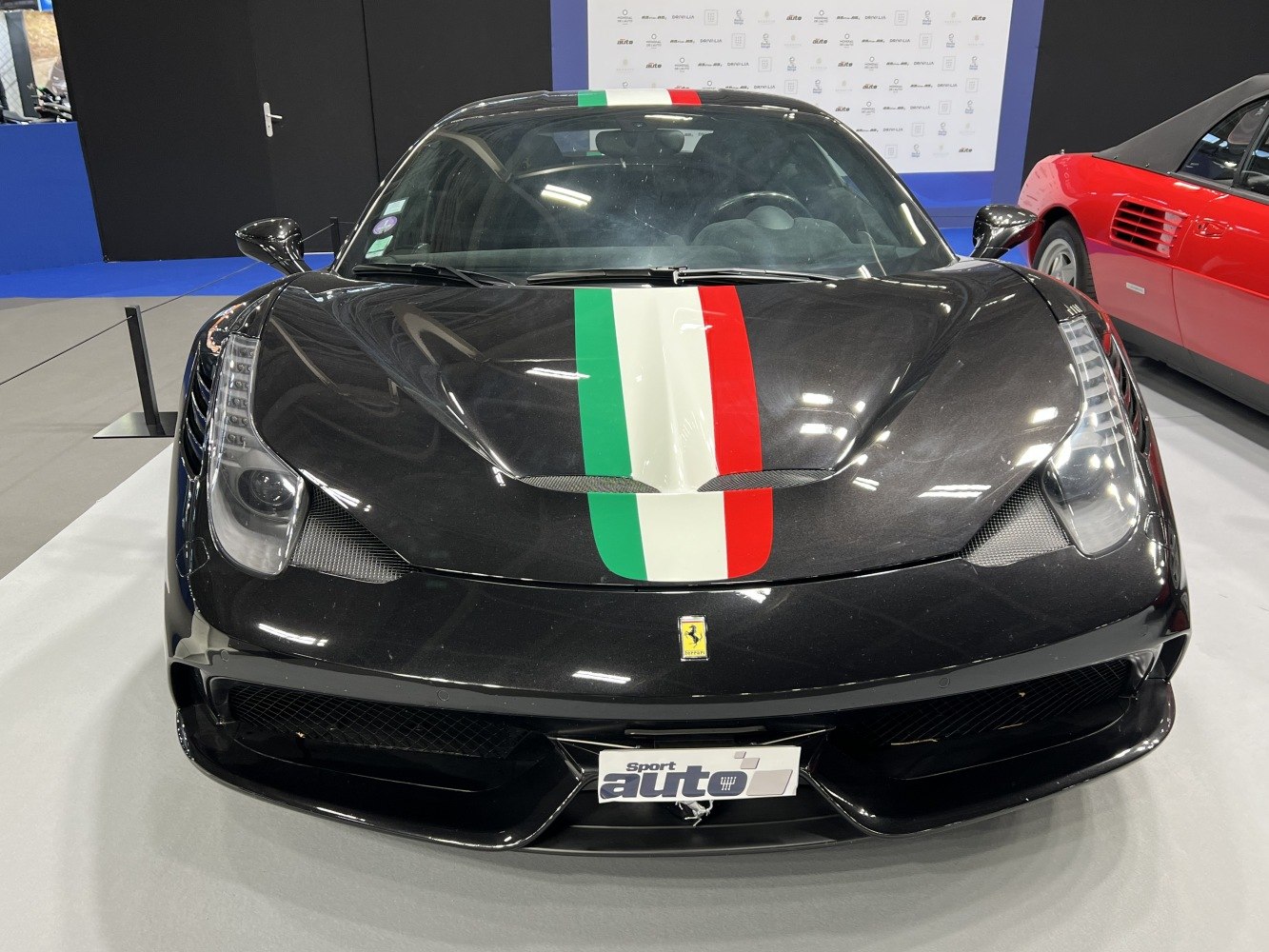 Front view of black Ferrari with Italian flag stripe