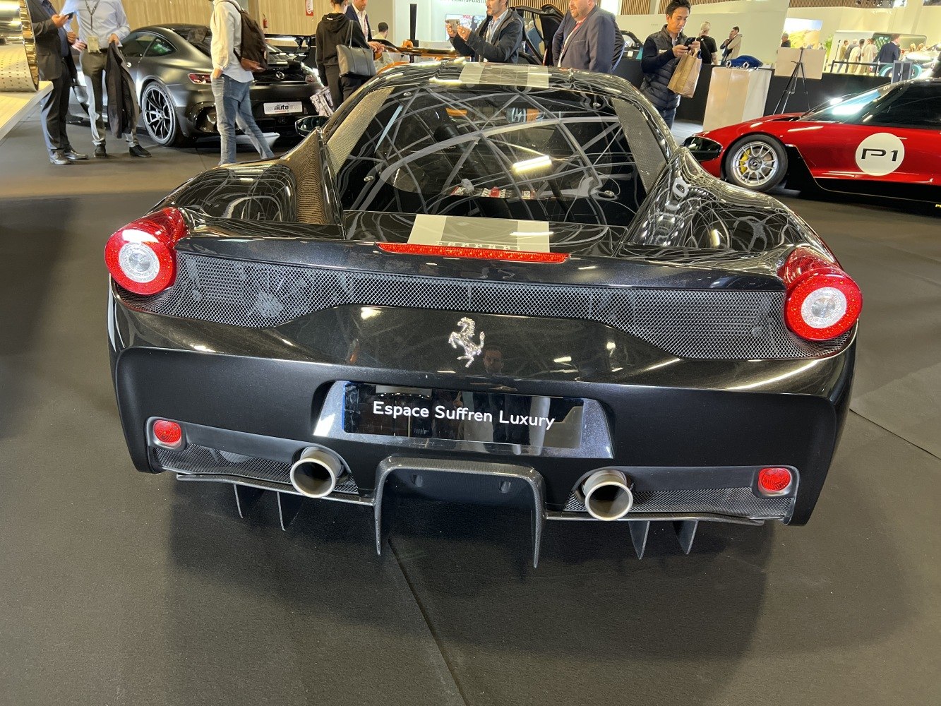 Dual exhaust pipes, round taillights, carbon fiber rear diffuser