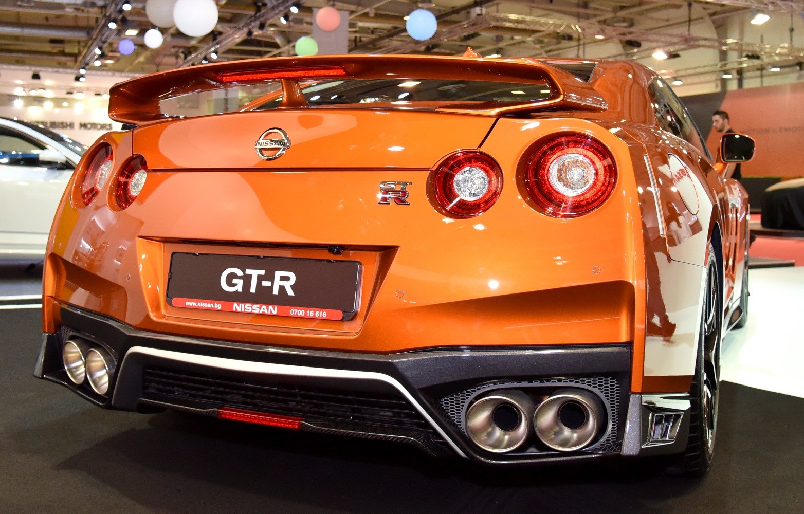 Rear view with quad exhausts and round tail lights
