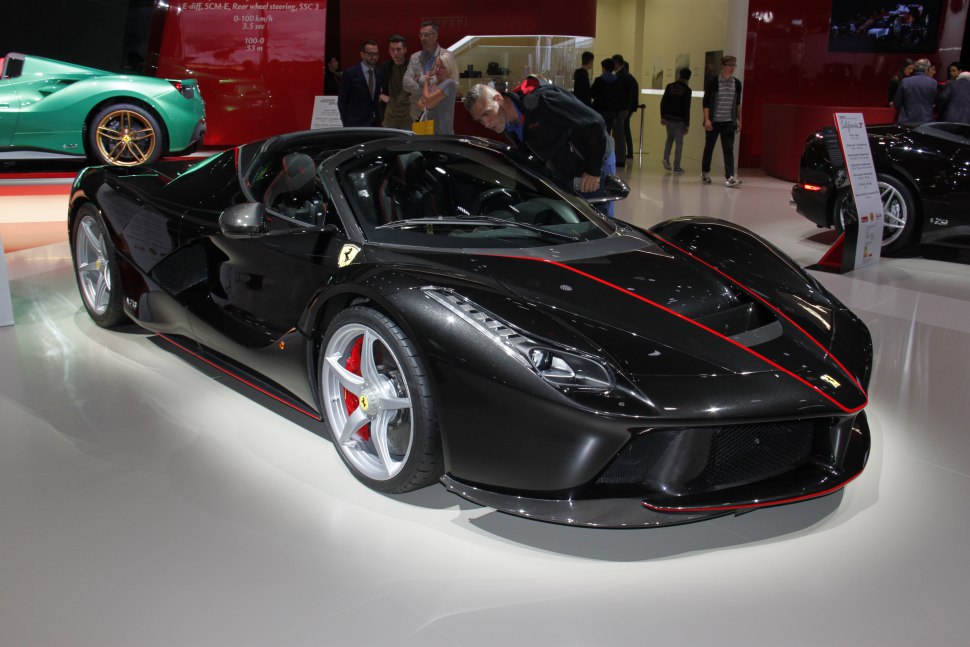 Black Ferrari LaFerrari Aperta with red trim and sharp LED headlights