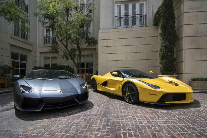 Yellow hybrid sports car with aerodynamic design and black alloy wheels