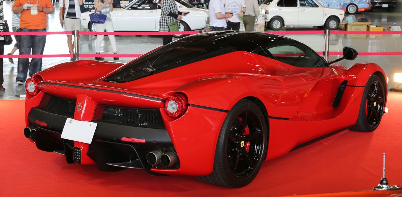 Aerodynamic rear view with quad exhaust and black roof