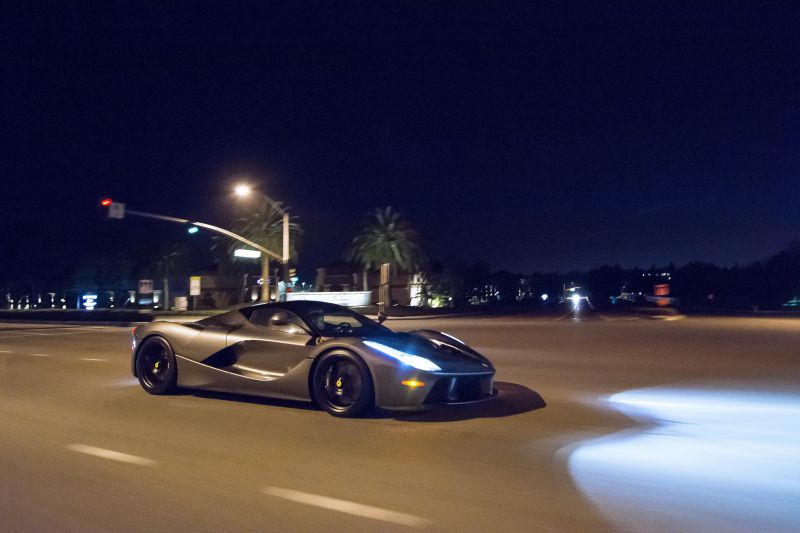 Ferrari LaFerrari in motion at night with LED headlights and aerodynamic body