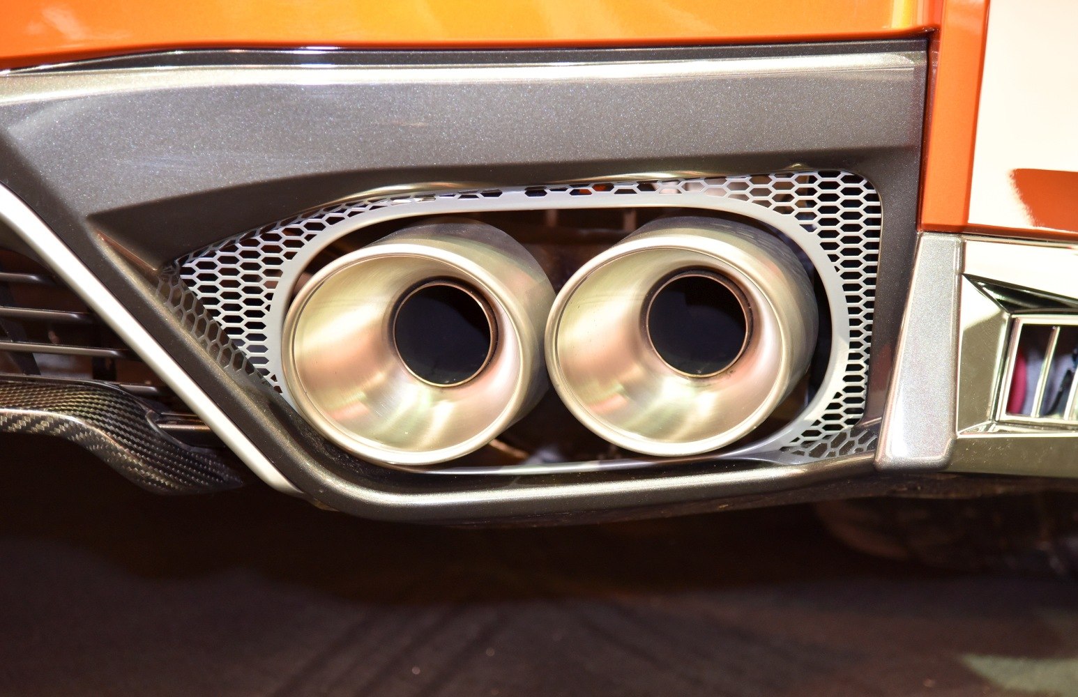 Dual exhaust tips with honeycomb grille and rear bumper accents