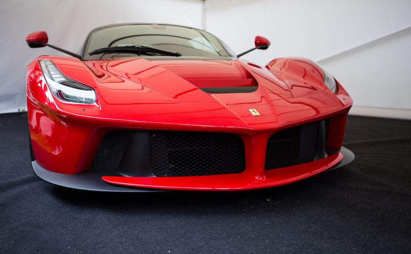 Red Ferrari LaFerrari front with aerodynamic grille and sharp headlights
