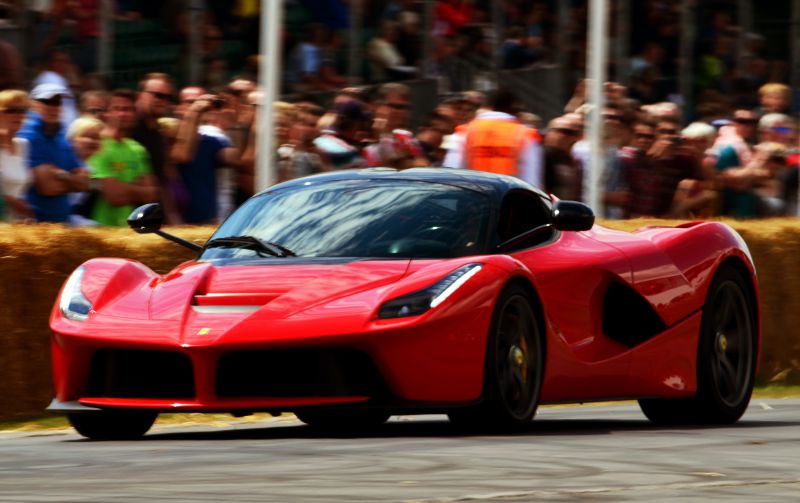 Red sports car with aerodynamic design and modern headlights