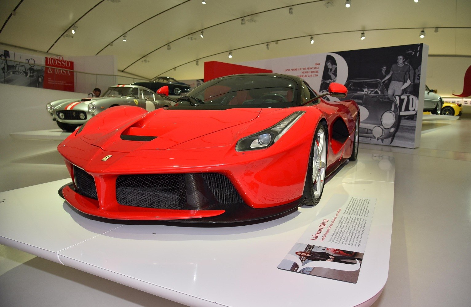 Aerodynamic front view with aggressive air intakes and sleek headlight design