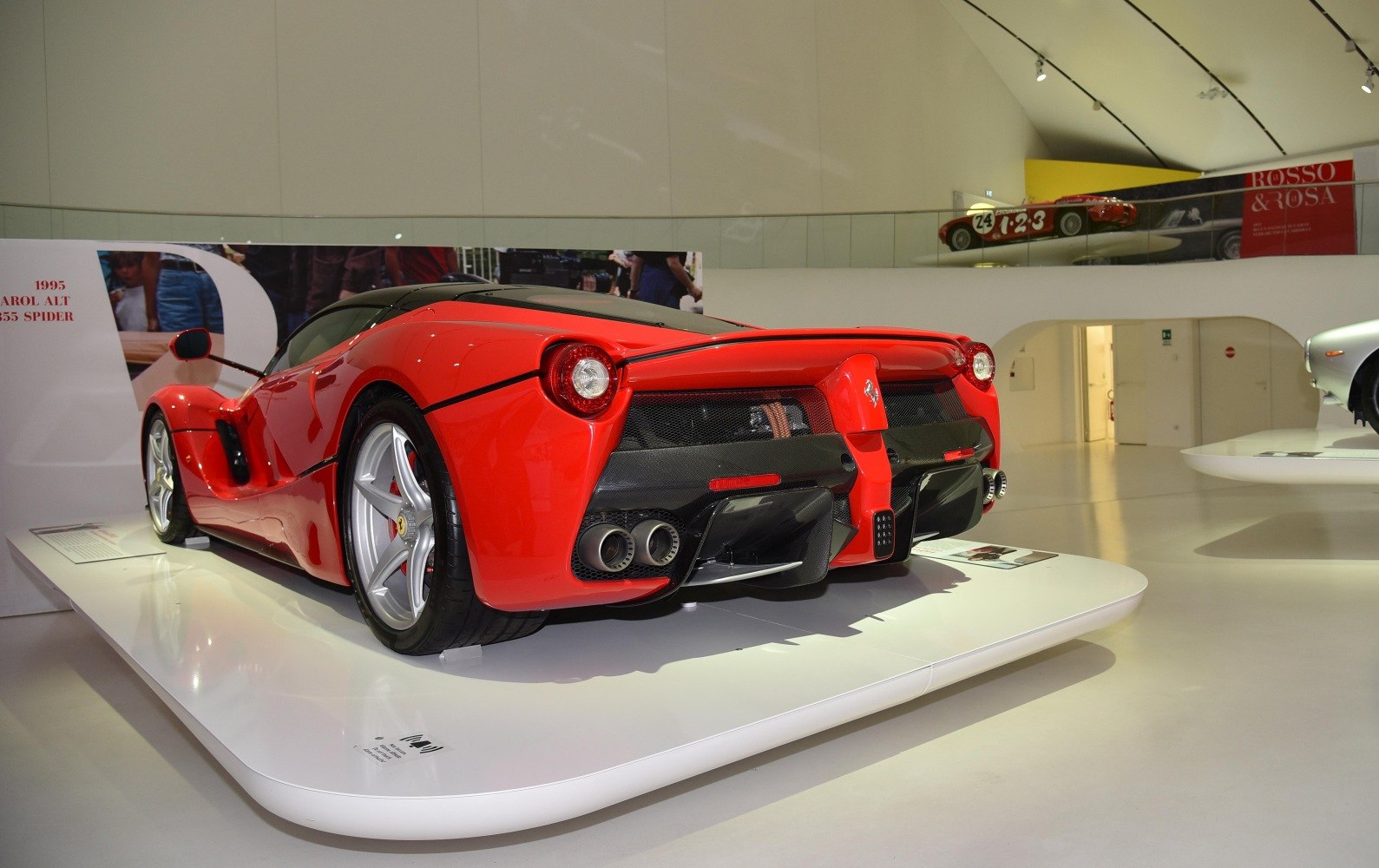 Rear view with quad exhausts and aerodynamic diffuser on red supercar