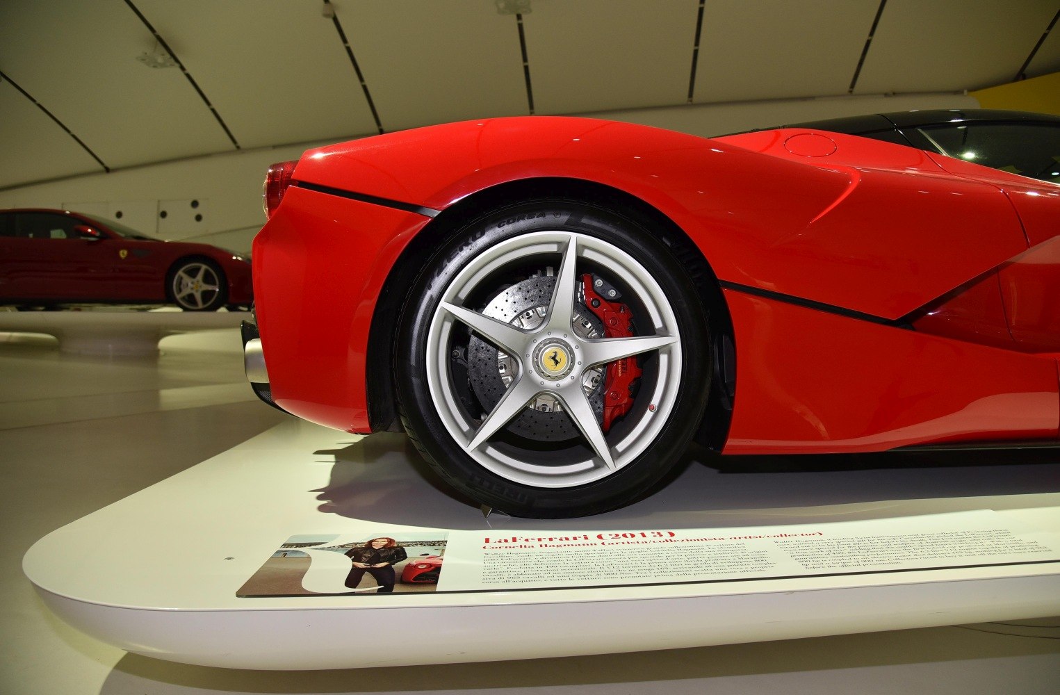 Close-up of rear alloy wheel and red brake caliper