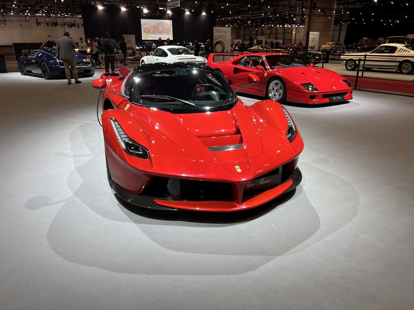 Front view of a red hypercar with sleek aerodynamic design and LED headlights