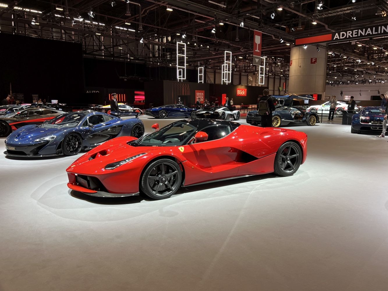 Red high-performance sports coupe with aerodynamic design and black wheels