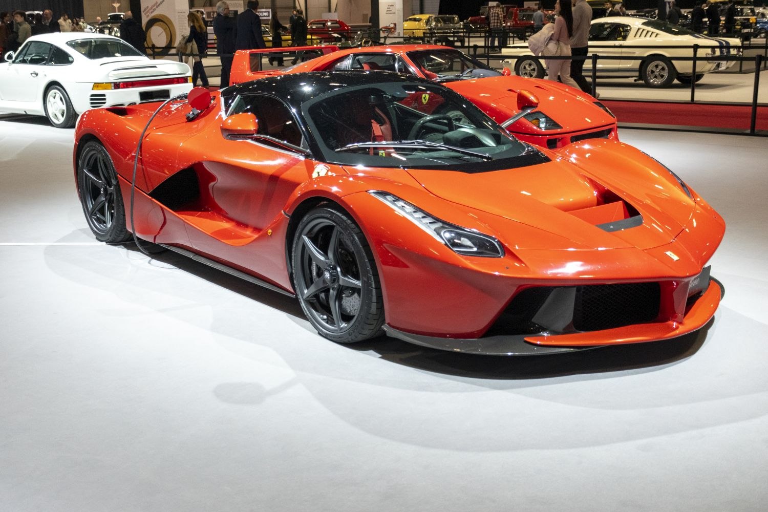 Aerodynamic modern front end with sporty wheels and detailed headlights.