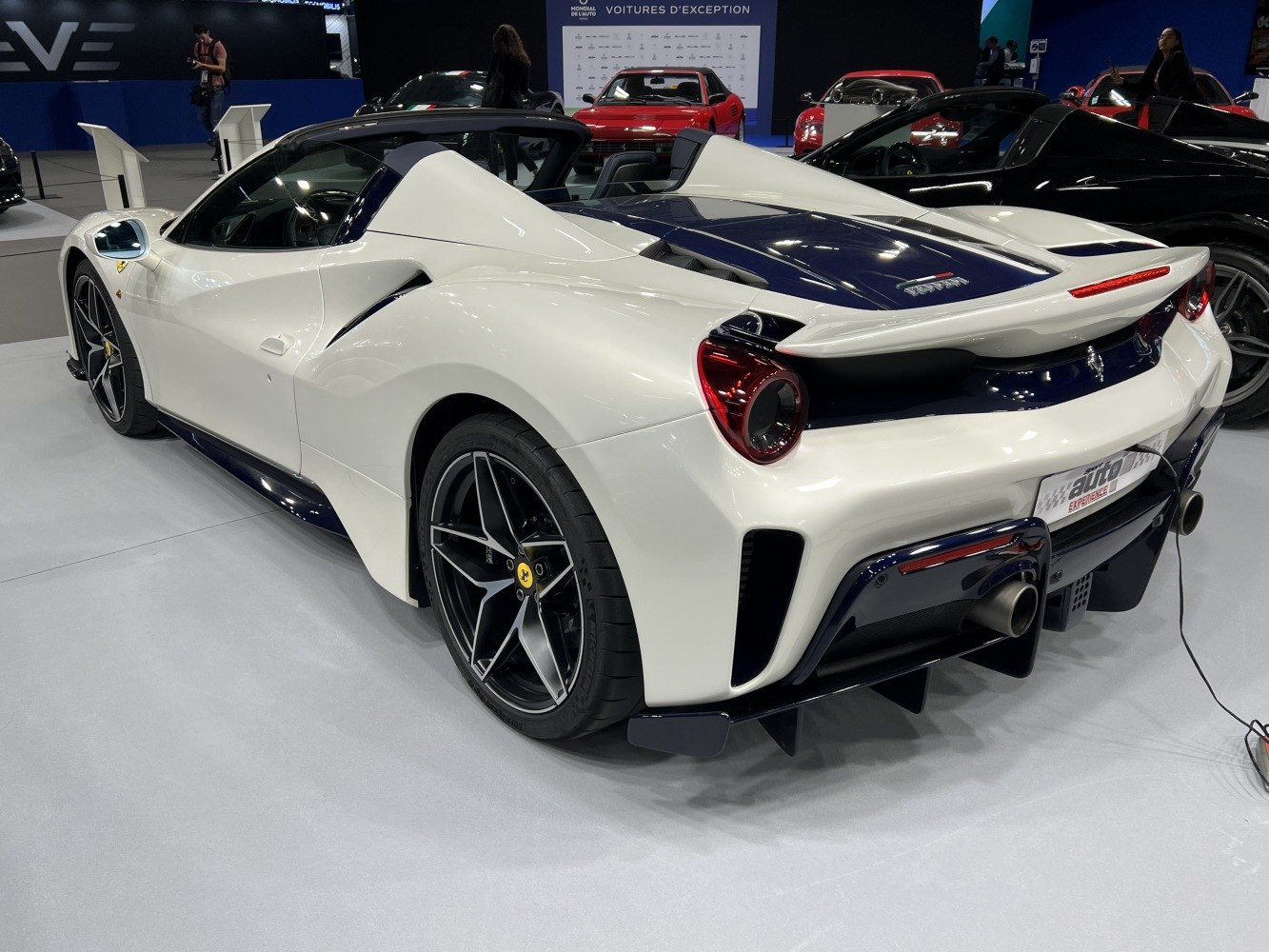 Rear three-quarter view highlighting rear diffuser and sleek tail lights