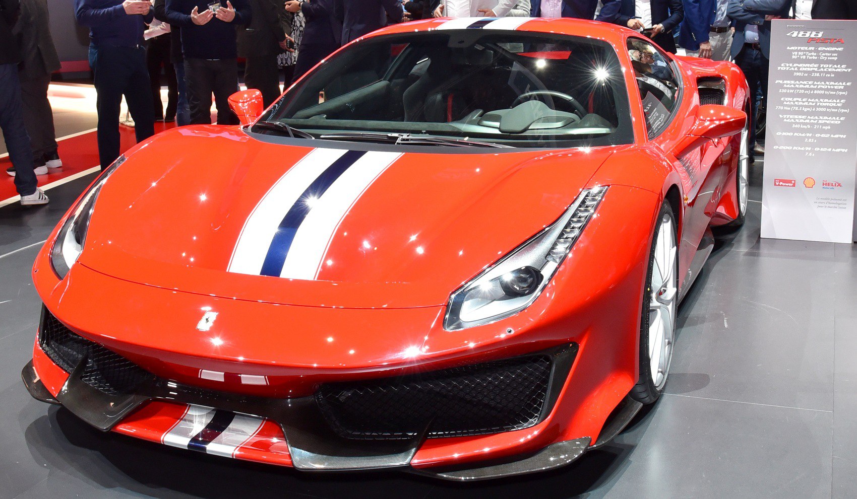 Front view of a high-performance sports car with racing stripe and aerodynamic design