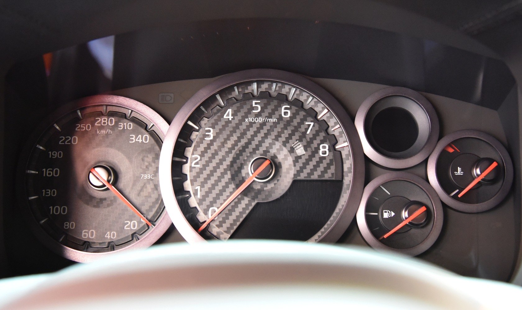 Carbon fiber styled tachometer, speedometer, fuel and temperature gauges cluster
